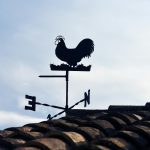 wind vane beside roof